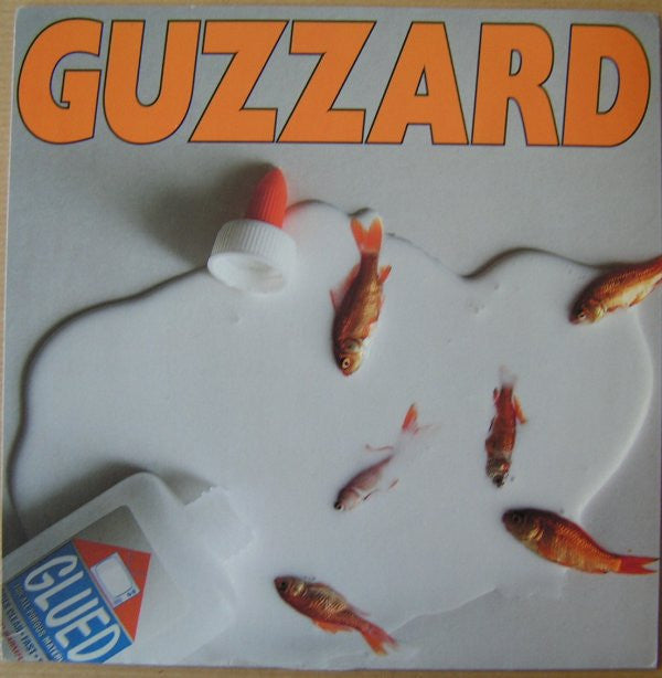 Guzzard : Glued (7", Single, Ora)