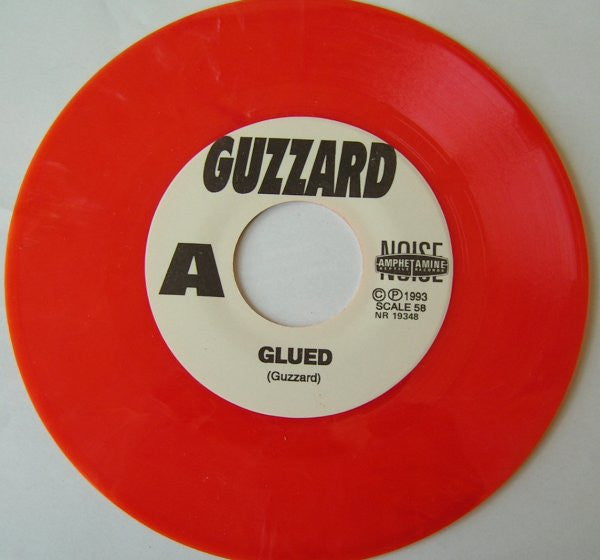 Guzzard : Glued (7", Single, Ora)