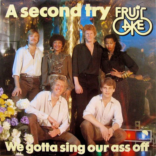 Fruitcake : A Second Try / We Gotta Sing Our Ass Off (12", Single)