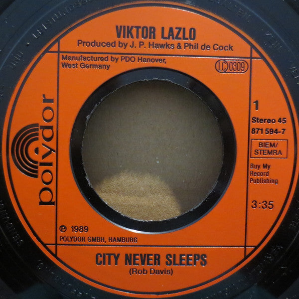 Viktor Lazlo : City Never Sleeps (7", Single)