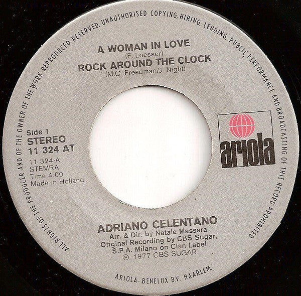 Adriano Celentano : A Woman In Love - Rock Around The Clock / Preghero (7", Single)