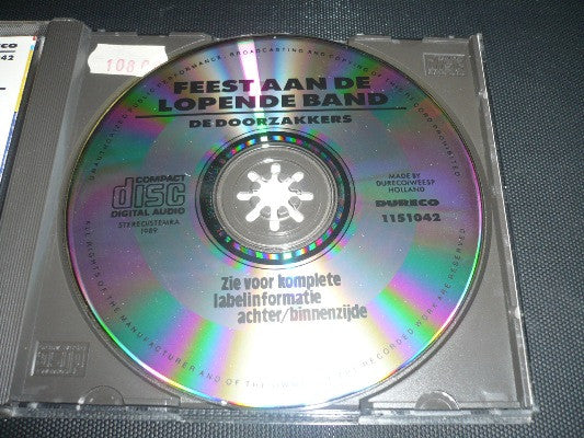 De Doorzakkers : Feest Aan De Lopende Band (CD)