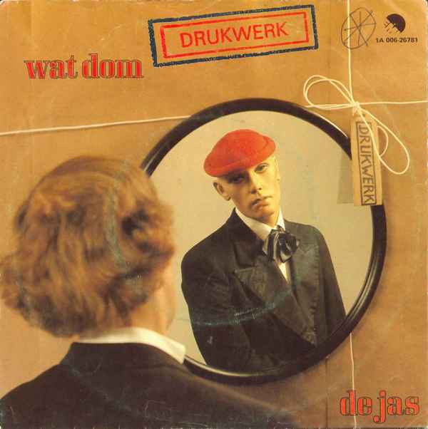 Drukwerk : Wat Dom / De Jas (7", Single)