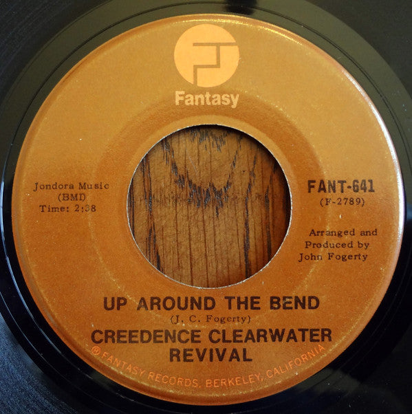 Creedence Clearwater Revival : Run Through The Jungle / Up Around The Bend (7", Single, RE)